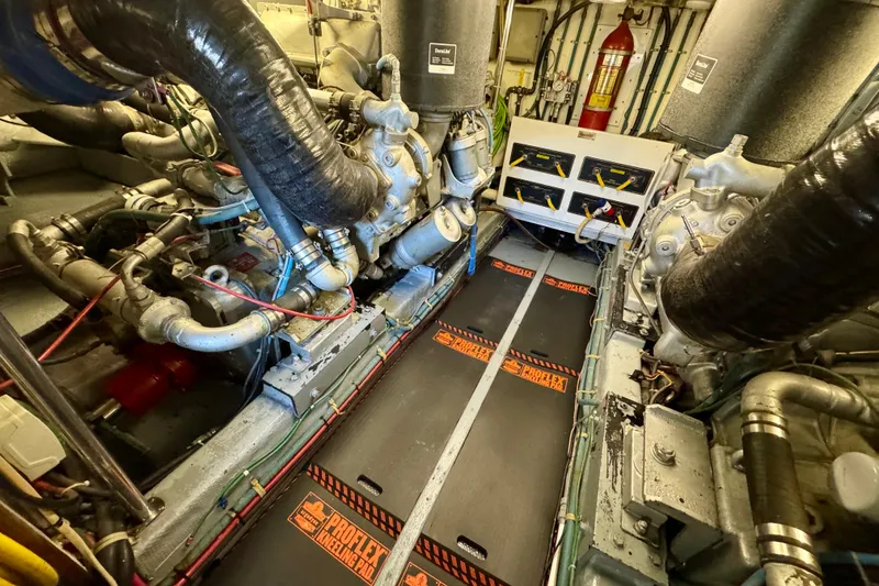 Slide: The Image of Engine room of 1993 Tollycraft 57 Pilothouse Motor Yacht with visible machinery and equipment. - 44