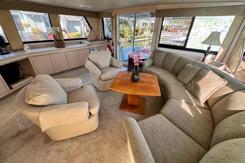 Slide: The Image of Luxurious interior of 1993 Tollycraft 57 Pilothouse Motor Yacht with elegant seating and decor. - 8