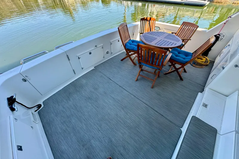 Slide: The Image of Luxurious interior of 1993 Tollycraft 57 Pilothouse Motor Yacht with plush seating and elegant decor. - 9