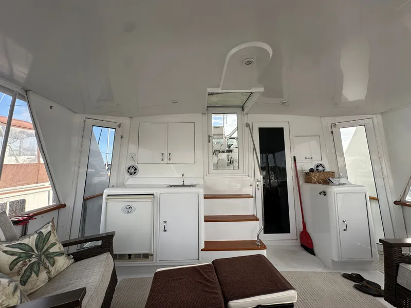 Slide: The Image of Interior of 1994 Hatteras 48 Cockpit MY yacht with seating and storage. - 10