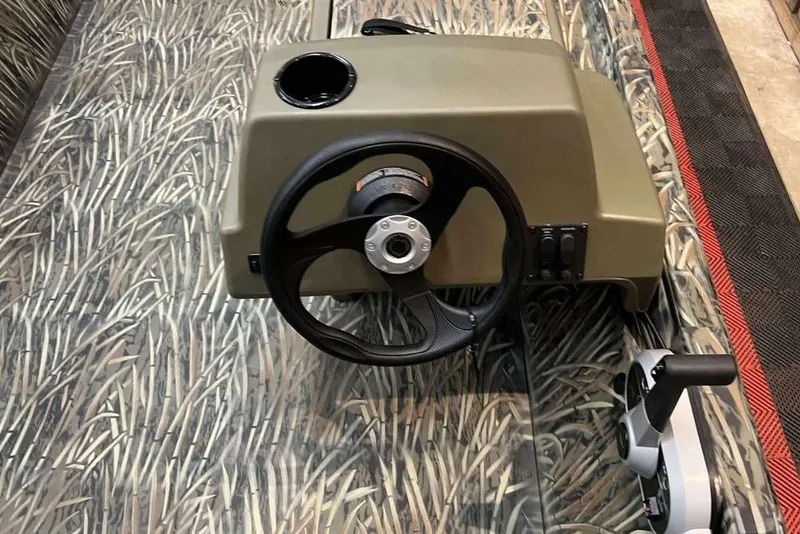 Slide: The Image of 2026 Tracker Grizzly 1648 SC steering console with camouflage design. - 8