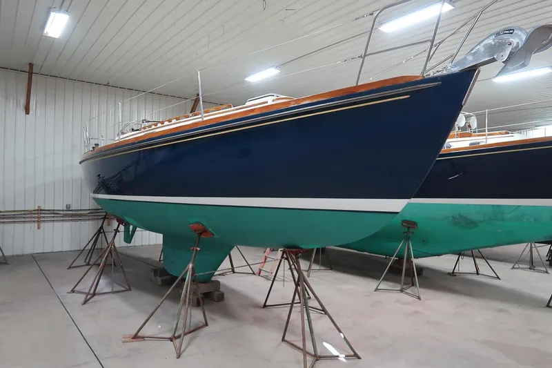 Slide: The Image of 1989 Morris Ocean Series 32 sailboat in indoor storage on stands. - 10
