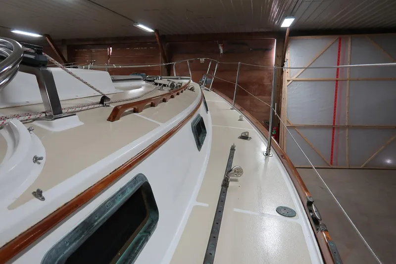 Slide: The Image of 1989 Morris Ocean Series 32 sailboat deck in indoor storage, showcasing sleek design and craftsmanship. - 12