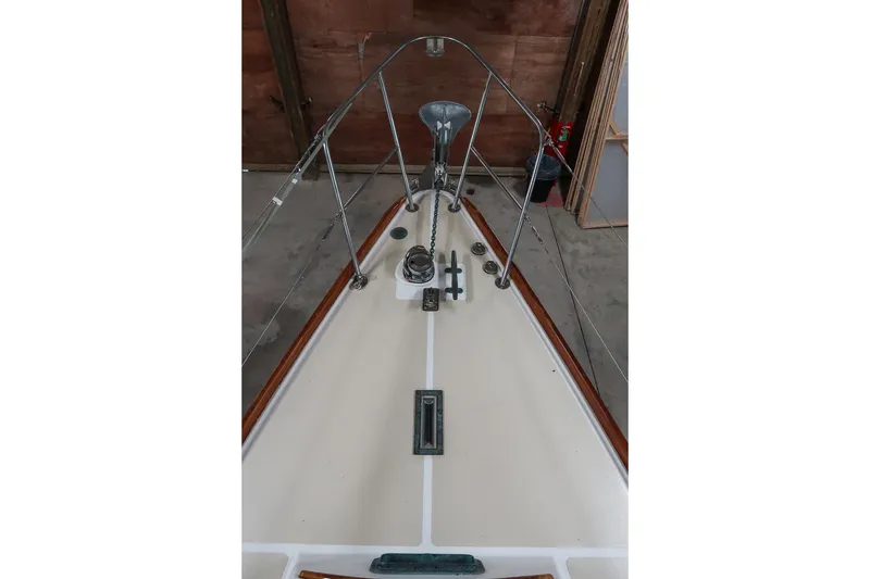 Slide: The Image of 1989 Morris Ocean Series 32 sailboat deck with stainless steel fittings and wooden trim. - 13