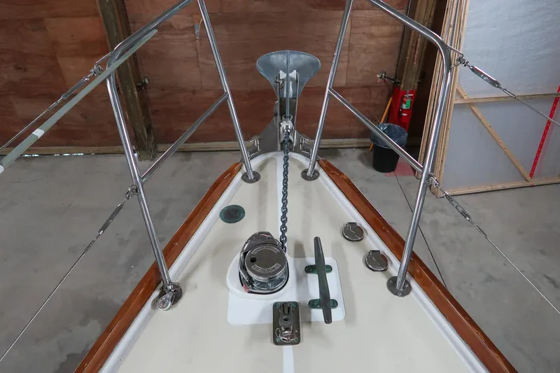 Slide: The Image of Bow of 1989 Morris Ocean Series 32 sailboat with anchor chain and deck fittings. - 14