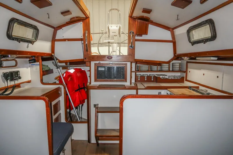 Slide: The Image of Interior of 1989 Morris Ocean Series 32 sailboat with wood accents and navigation equipment. - 16