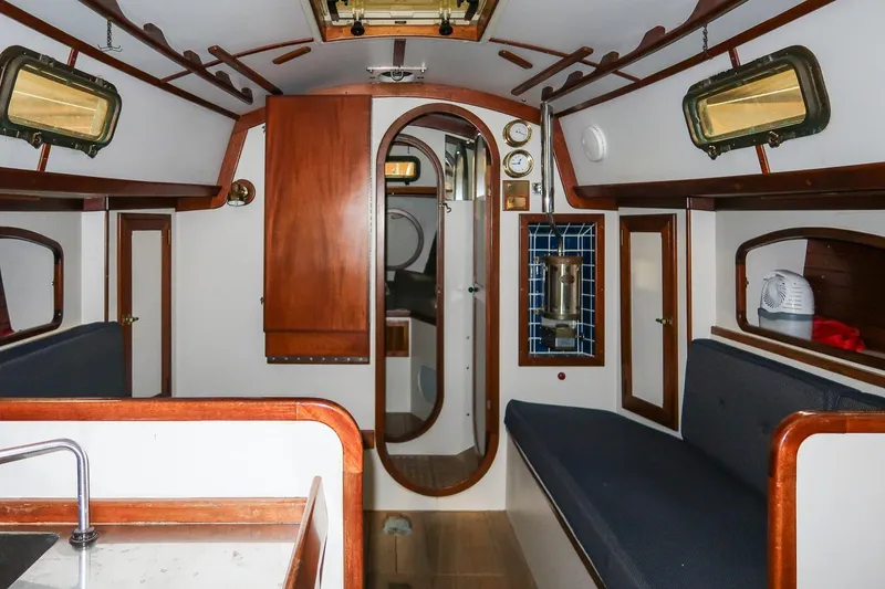 Slide: The Image of Interior of 1989 Morris Ocean Series 32 sailboat with wooden accents and seating. - 17
