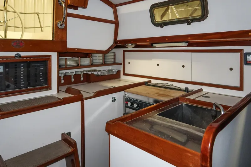 Slide: The Image of Interior of 1989 Morris Ocean Series 32 yacht kitchen with wooden cabinetry and appliances. - 18