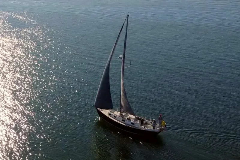 Slide: The Image of Sailboat Morris Ocean Series 32, 1989, gliding on sunlit water. - 2