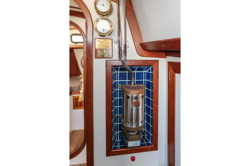 Slide: The Image of 1989 Morris Ocean Series 32 interior with nautical instruments and heater. - 25
