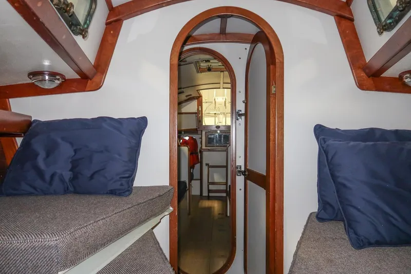 Slide: The Image of Interior of 1989 Morris Ocean Series 32 sailboat with cozy cabin and wooden accents. - 31