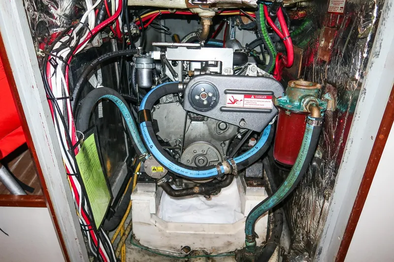 Slide: The Image of Engine compartment of a 1989 Morris Ocean Series 32 sailboat, showing wiring and components. - 35