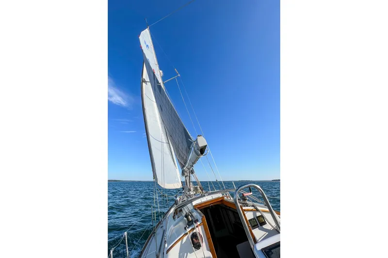 Slide: The Image of Sailing on a 1989 Morris Ocean Series 32 under clear blue skies. - 6