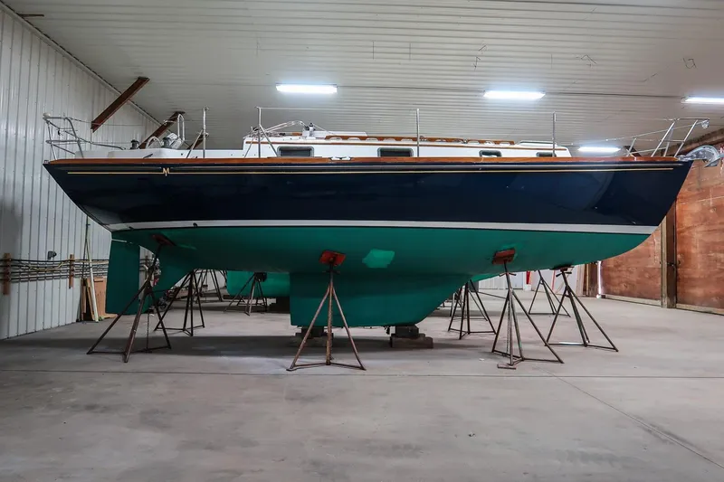 Slide: The Image of 1989 Morris Ocean Series 32 sailboat in indoor storage on stands. - 7