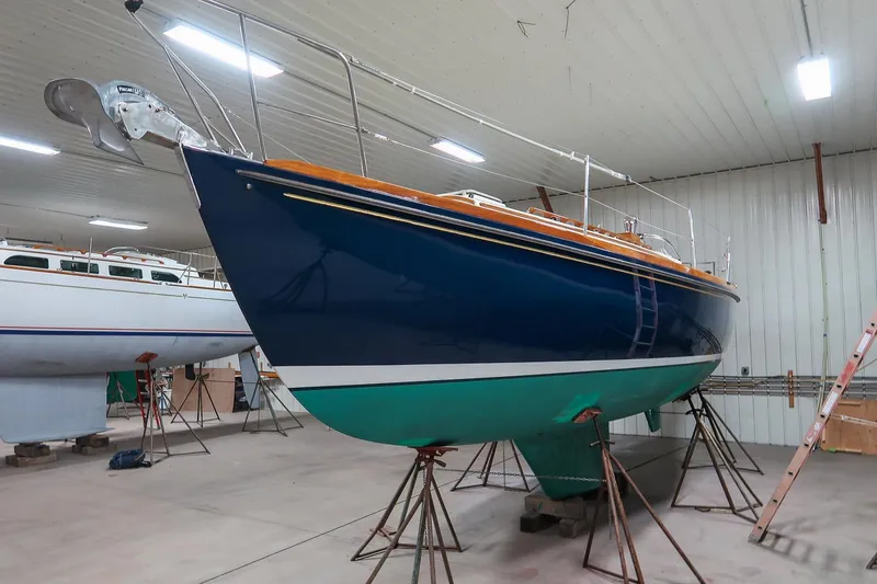 Slide: The Image of 1989 Morris Ocean Series 32 sailboat in indoor storage on stands. - 9
