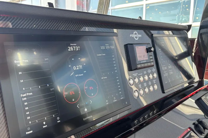 Slide: The Image of Dashboard of 2021 Fountain 38 SC boat with digital displays and controls. - 10