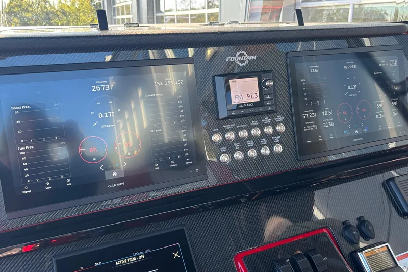 Slide: The Image of Dashboard of 2021 Fountain 38 SC boat with Garmin displays and controls. - 11