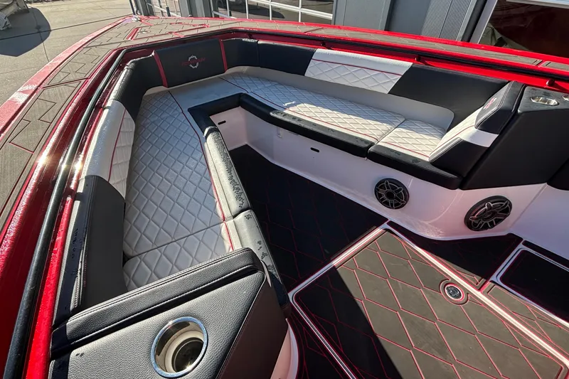 Slide: The Image of 2021 Fountain 38 SC boat interior with red and black seating and speakers. - 18