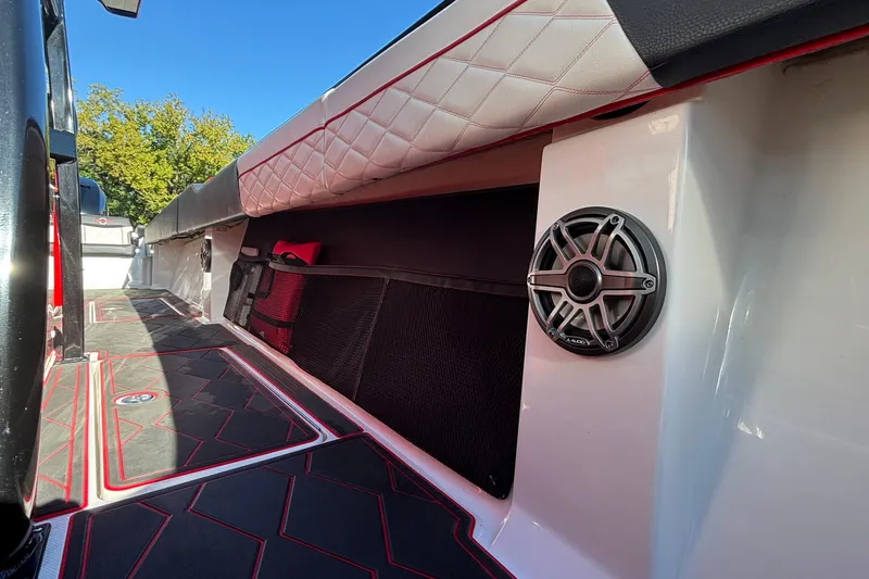 Slide: The Image of 2021 Fountain 38 SC boat interior with speaker and quilted seating. - 20