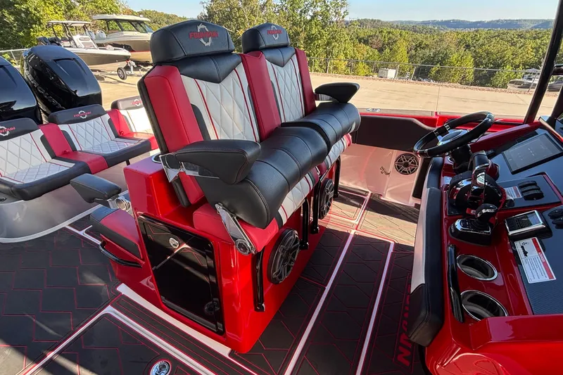 Slide: The Image of Interior of 2021 Fountain 38 SC boat with red and black seating and controls. - 21