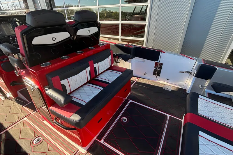 Slide: The Image of 2021 Fountain 38 SC boat interior with red and black seating and modern design. - 28