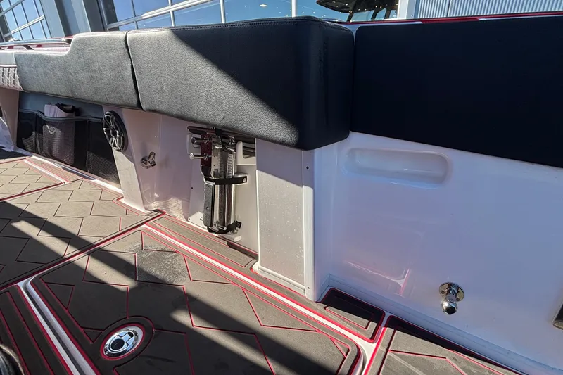 Slide: The Image of Interior view of 2021 Fountain 38 SC boat with cushioned seating and modern flooring. - 29