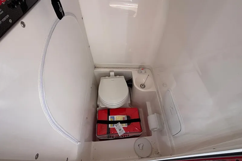 Slide: The Image of 2021 Fountain 38 SC boat interior with toilet and life jackets. - 34