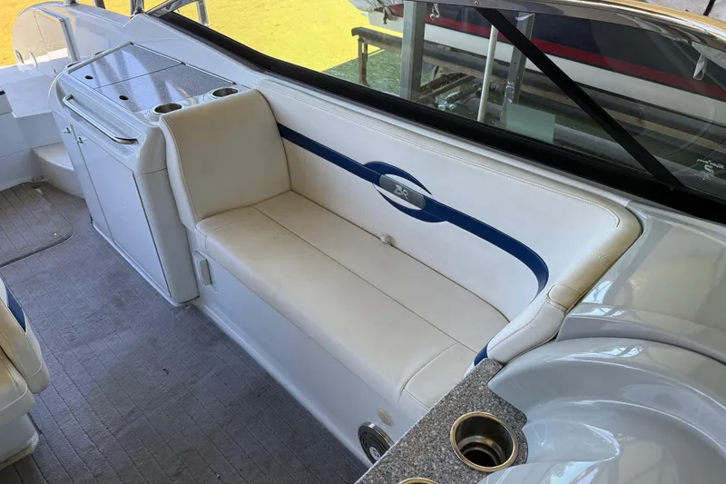 Slide: The Image of 2008 Formula 310 Bowrider interior with white seating and cup holders. - 10