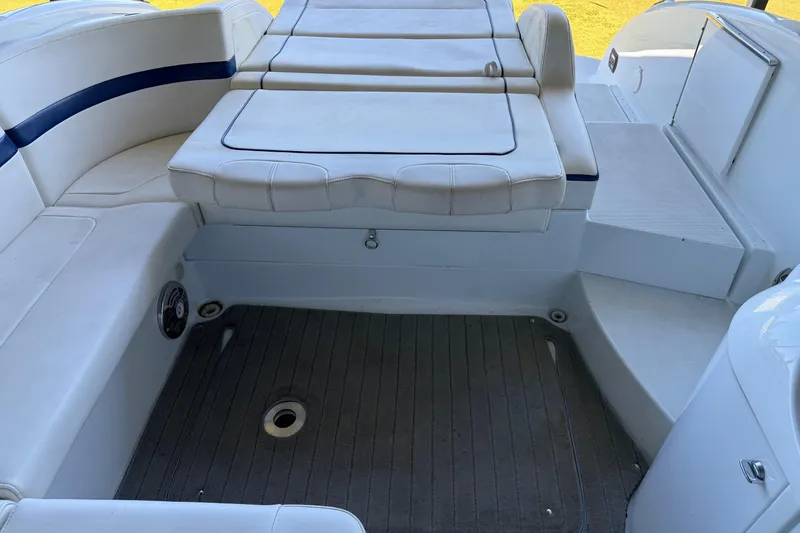 Slide: The Image of 2008 Formula 310 Bowrider interior with white seating and carpeted floor. - 13