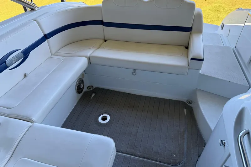 Slide: The Image of 2008 Formula 310 Bowrider interior with white seating and blue accents. - 14