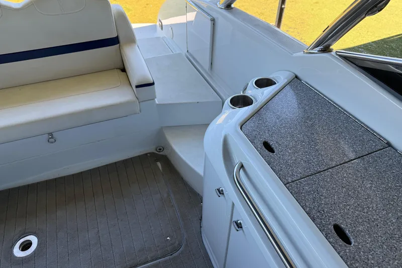 Slide: The Image of 2008 Formula 310 Bowrider interior with seating, cup holders, and countertop. - 15