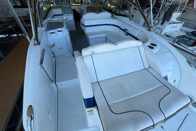 Slide: The Image of 2008 Formula 310 Bowrider interior with white seating and sleek design. - 16