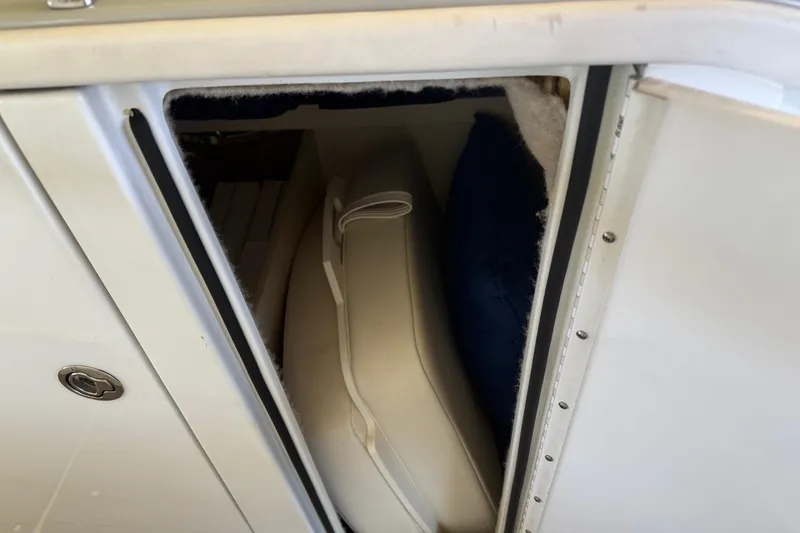 Slide: The Image of Storage compartment in a 2008 Formula 310 Bowrider boat, showing interior cushions. - 20
