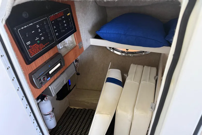 Slide: The Image of 2008 Formula 310 Bowrider cabin interior with control panel and cushions. - 21