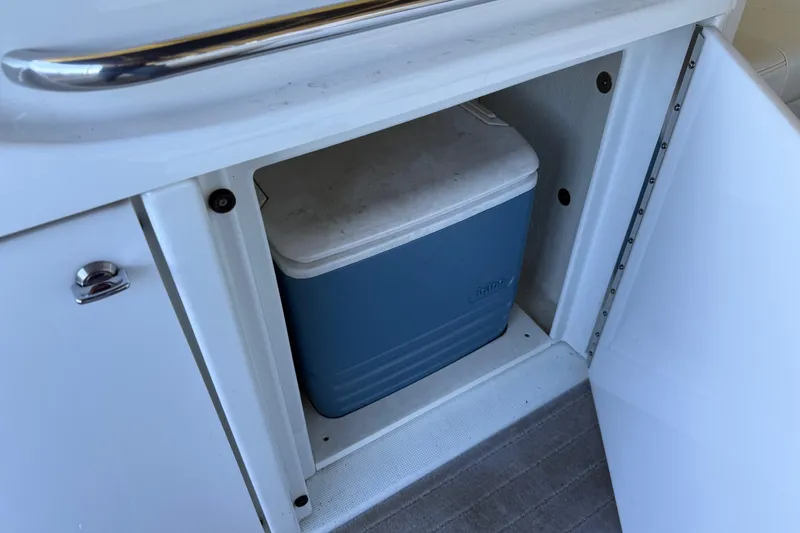 Slide: The Image of Storage compartment with cooler on a 2008 Formula 310 Bowrider boat. - 23