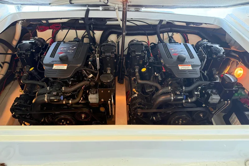 Slide: The Image of Twin Mercury engines in a 2008 Formula 310 Bowrider boat engine compartment. - 27
