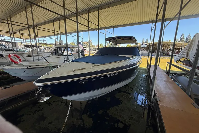 Slide: The Image of 2008 Formula 310 Bowrider docked in a covered marina. - 33