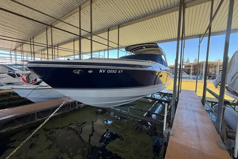Slide: The Image of 2008 Formula 310 Bowrider boat docked in covered marina. - 34