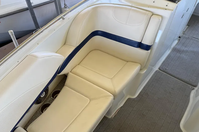 Slide: The Image of 2008 Formula 310 Bowrider interior seating with beige and blue upholstery. - 7