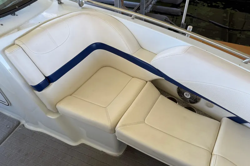 Slide: The Image of 2008 Formula 310 Bowrider interior seating with white and blue upholstery. - 8