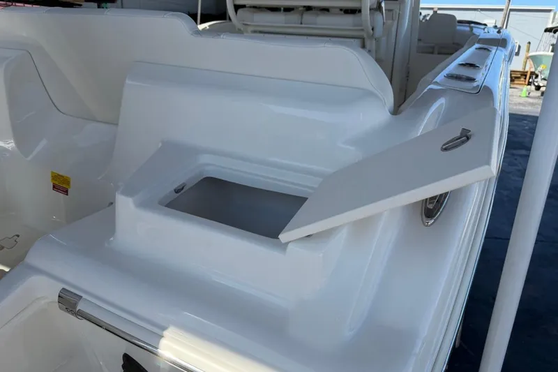 Slide: The Image of 2026 Key West 239 FSR boat with open storage compartment on deck. - 11