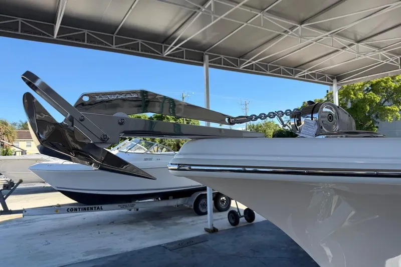 Slide: The Image of 2026 Key West 239 FSR boat with anchor, parked under a canopy. - 12