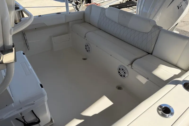 Slide: The Image of 2026 Key West 239 FSR boat interior with cushioned seating and modern design. - 13