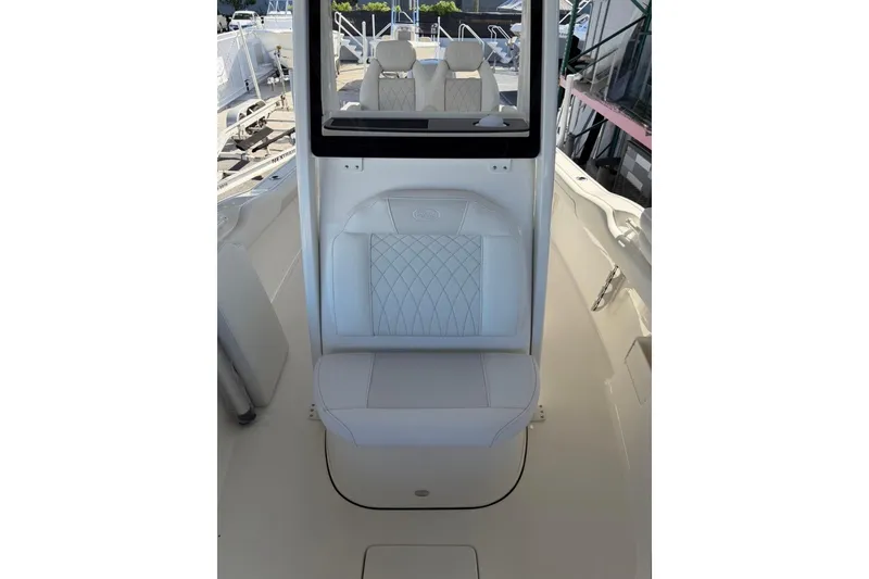 Slide: The Image of 2026 Key West 239 FSR boat interior with white cushioned seating and sleek design. - 25