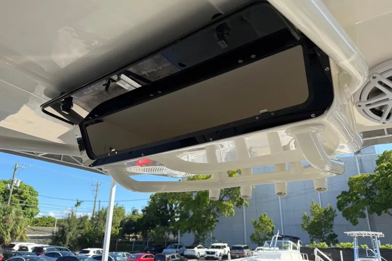 Slide: The Image of 2026 Key West 239 FSR boat with overhead storage compartment and speaker system. - 34