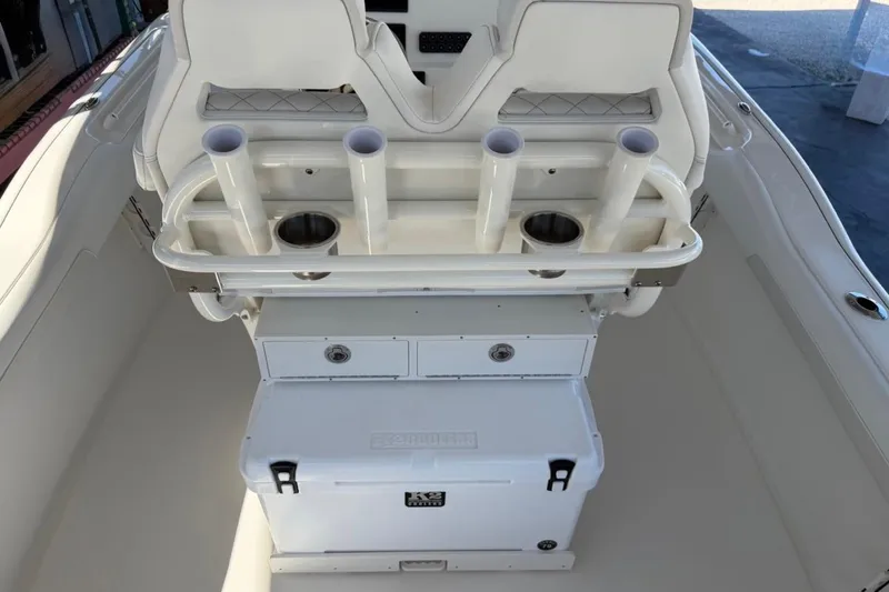 Slide: The Image of 2026 Key West 239 FSR boat interior with rod holders and storage compartments. - 35