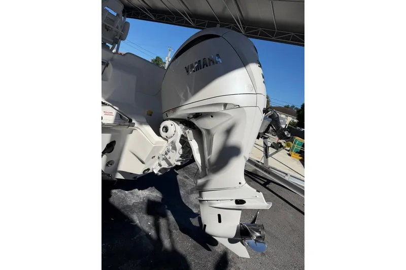 Slide: The Image of 2026 Key West 239 FSR boat with Yamaha outboard motor under a canopy. - 4