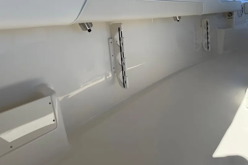 Slide: The Image of Interior view of 2026 Key West 239 FSR boat, showcasing sleek white design and storage features. - 40