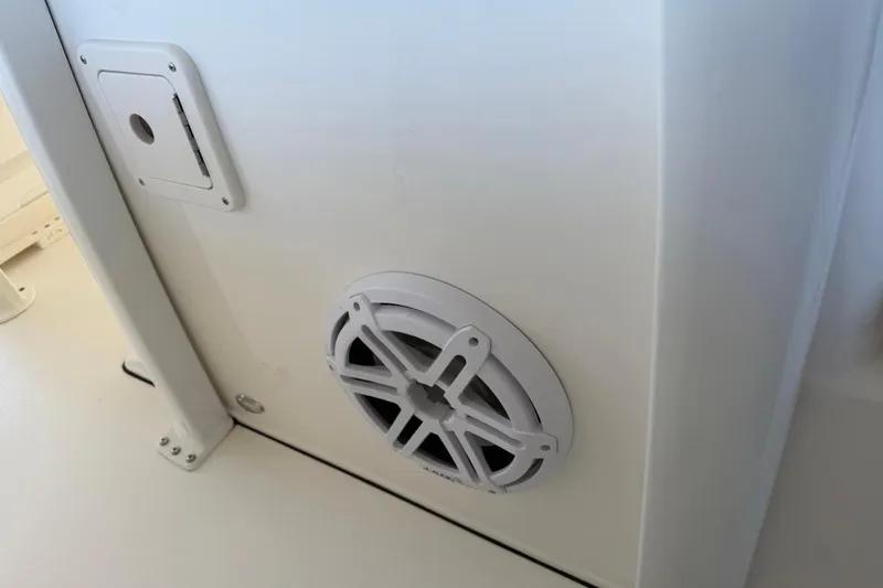 Slide: The Image of Key West 239 FSR 2026 boat interior with speaker and access panel. - 46