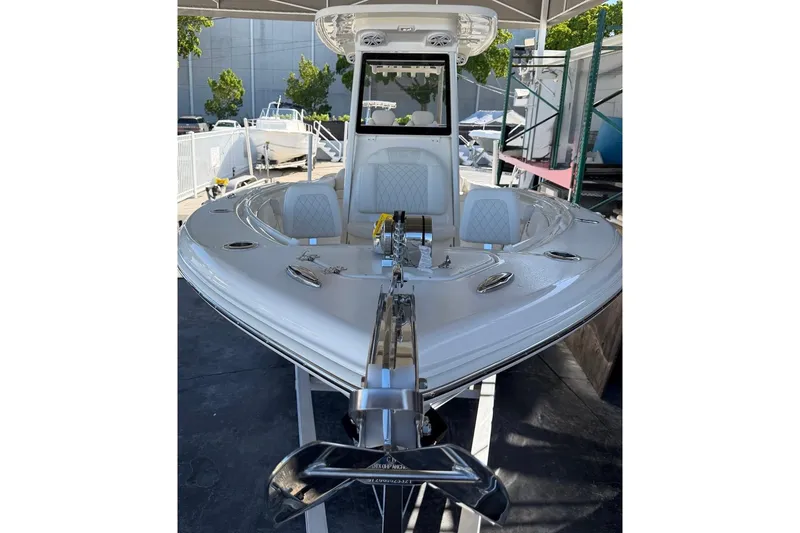 Slide: The Image of 2026 Key West 239 FSR boat displayed outdoors, showcasing sleek design and modern features. - 6